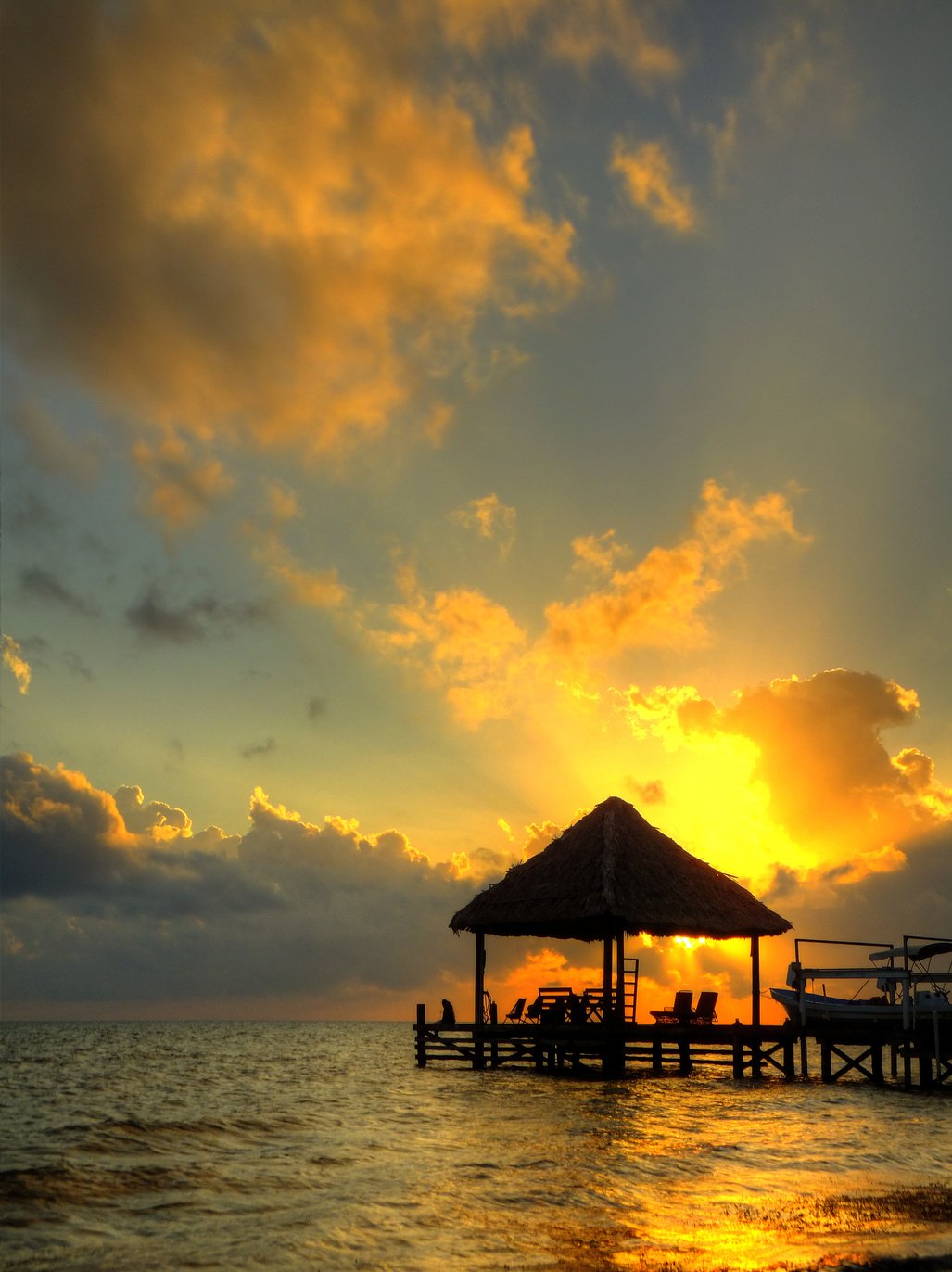 Belize sunset palapa ambergris caye